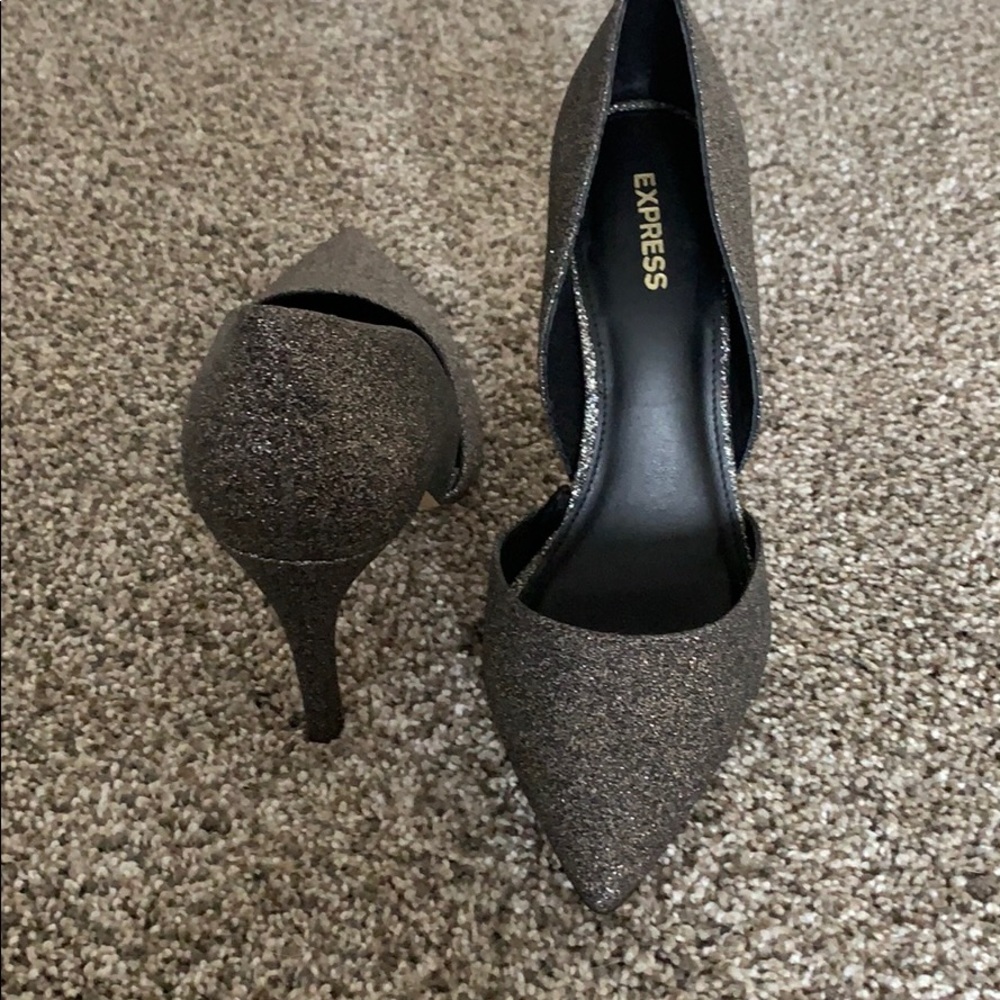 Express sparkly grey high heels.